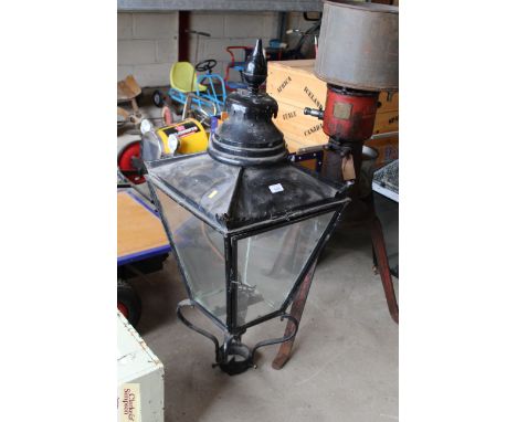 A Victorian gas lamp top case converted to electricity, surmounted by a turned finial, 43" high
