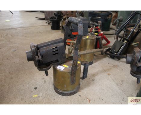 A brass and metal ware pressurised blow lamp with turned wooden handle and dial