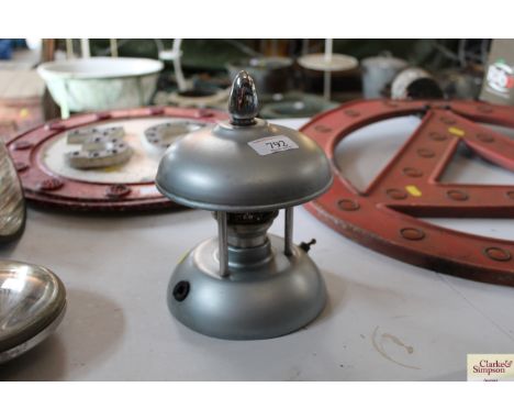 A domed rise and fall desk lamp
