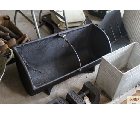 A cast iron two division feeding trough, approx. 31" long