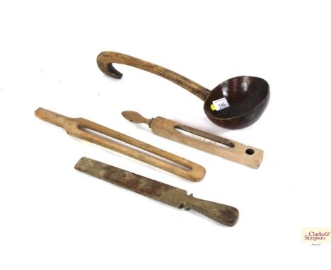 A 19th Century treen dairy ladle with hook handle, a dairy thermometer and two other treen dairy items