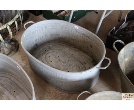 An oval galvanised twin handled planter, approx. 33" long overall