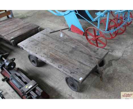 A rustic wooden and metal four wheel engine  trolley by H &amp; H Stark Ltd. London