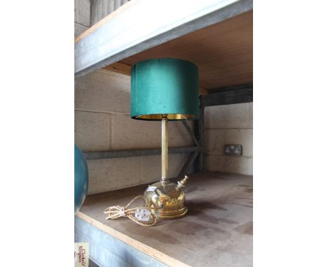 A brass table lamp, in the form of a Tilley lamp with green shade, 55cm high 