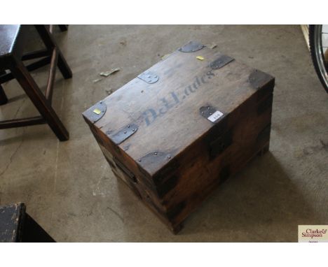 A wooden and metal bound trunk inscribed D.J. Eades