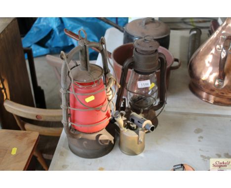 Two old Hurricane lamps and a blow lamp