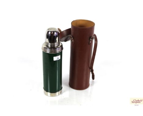 A vintage Isovac Thermos flask in leather travelling case