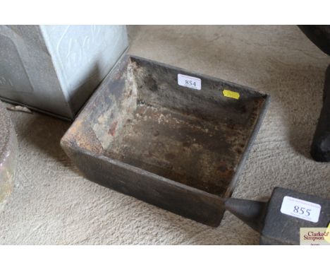 A small cast iron trough