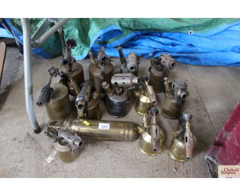 A quantity of brass blow lamps, one cut out blow lamp and a fire extinguisher