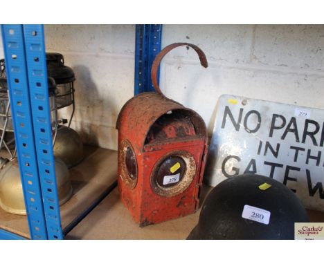 A vintage red painted road lamp
