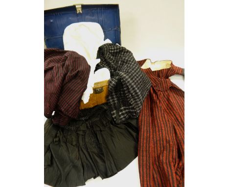A LARGE COLLECTION OF TRADITIONAL WELSH CLOTHING, circa 1900-1910 and including skirts / underskirts with red and black verti
