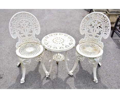 A pair of white painted cast iron chairs and a similar table (3).