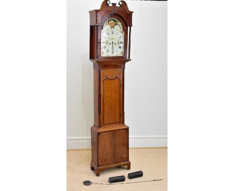 An early 19th century eight day longcase clock, with broken swan neck pediment with applied cabochons depicting a seated figu