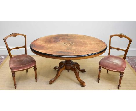 A Victorian inlaid walnut loo table, length 127cm, and six late Victorian dining chairs on turned columns (7)
