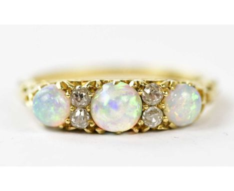 A Victorian yellow metal opal and diamond set dress ring, size J, approx weight 3g.