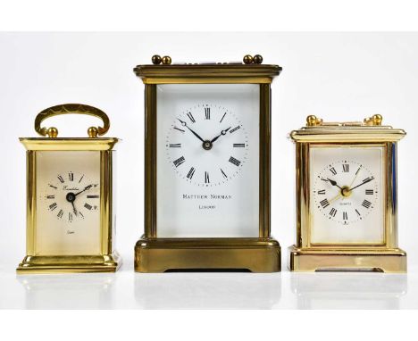 MATTHEW NORMAN; a brass cased carriage clock, numbered 1754 to the reverse, height 11cm, and two miniature carriage clocks wi