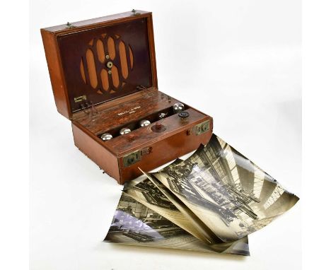 ROLLS-CAYDON; a vintage tan leather valve radio set, with bakelite interior, length 40cm, with four black and white photograp