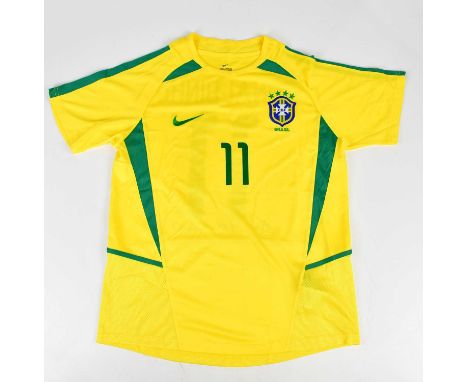 RONALDINHO; a 2002 signed Brazil retro style football shirt, signed to the reverse, size L.Condition Report: Creasing and lig