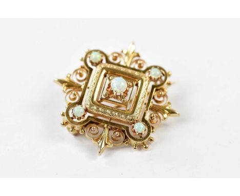 An Edwardian yellow metal and opal set brooch, indistinctly marked, gross weight approx. 4.2g, length 3cm.