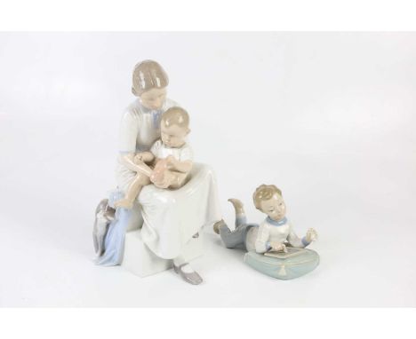 ROYAL COPENHAGEN; a figure group of mother and child, height 32cm, together with a Nao figure of child playing with a chalk b