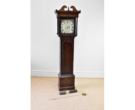 An 18th century and later eight day longcase clock, the painted face with Roman numerals and two subsidiary dials, in an asso