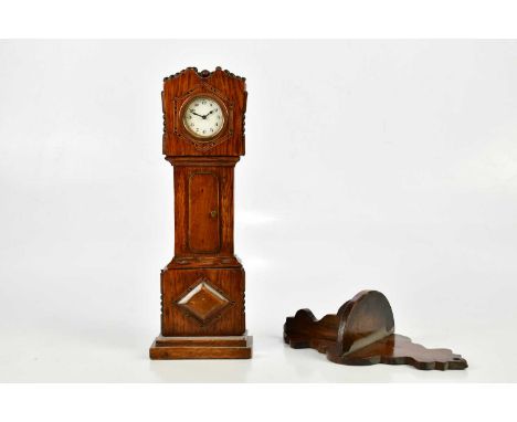 An oak miniature longcase clock, the dial set with Arabic numerals, height 36cm and an associated Edwardian mahogany bracket 
