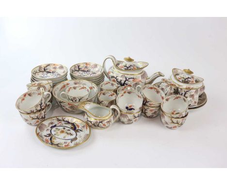 An early 19th century English porcelain Imari part tea and coffee service, possibly Spode, decorated with trees and roses, co
