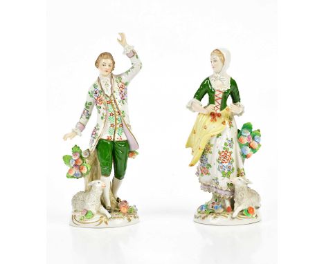 SITZENDORF; a pair of 20th century figures representing a gentleman and lady beside sheep, height 16cm (2).Condition Report: 