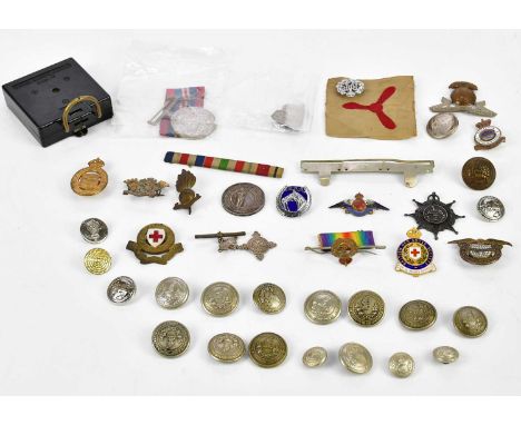 A collection of militaria, including a hallmarked silver Egypt Medal, Manchester Regiment, awarded to Private G.A Ormesher, d