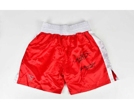 CARL WEATHERS (APOLLO CREED); a pair of red and white signed boxing shorts, inscribed 'There ain't gonna be no re-match', siz