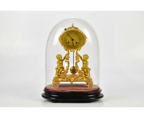 A late 19th century ormolu mantel clock, the oval dial set with Roman numerals on scrolling sabre supports flanked by cherubs