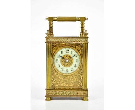 A brass cased carriage clock, the white enamel dial set with Roman numerals, height 15cm.