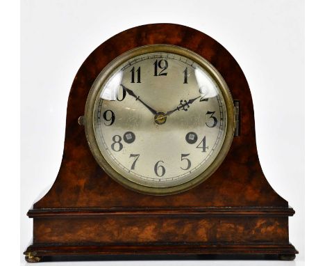 A 1930s walnut mantel clock with silvered dial set with Arabic numerals, with German movement, height 20cm, with key and pend