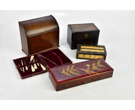An early 20th century dome topped stationery cabinet, a porcupine quill box, a Japanese tea caddy decorated with an exotic bi