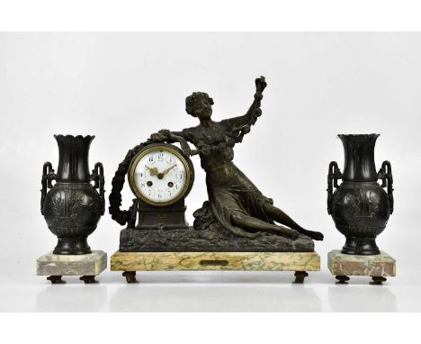 An early 20th century three piece clock garniture, comprising a cast spelter figural clock representing a maiden beside the c