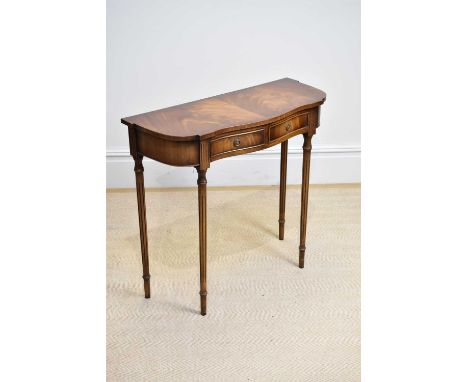 A reproduction mahogany serpentine fronted two drawer side table, length 73cm, height 74cm.
