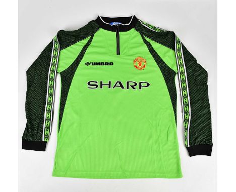 PETER SCHMEICHEL; a Manchester United Treble Winners retro style signed football shirt, signed to the reverse, size L.Conditi