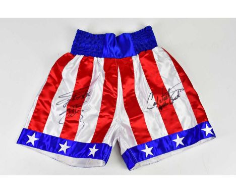 ROCKY; a pair of 'Stars and Stripes' signed boxing shorts, signed by Sylvester Stallone and Carl Weather, size S.Condition Re