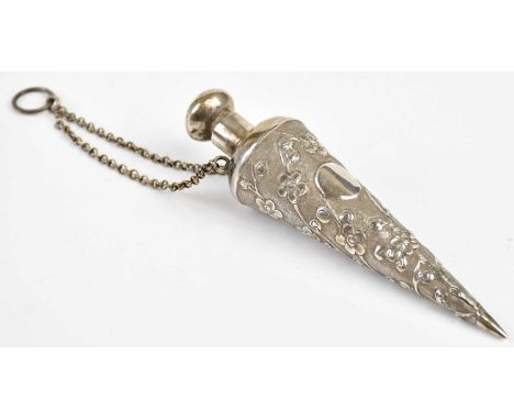 A Chinese white metal (probably silver) perfume bottle of tapering cylindrical form, cast with prunus flowers and vacant circ