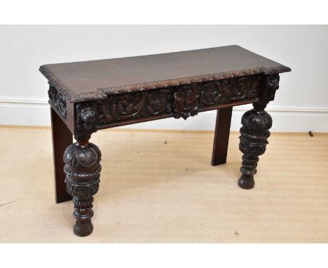 A 19th century Flemish style carved oak side table, height 88cm, width 121cm, depth 47cm.