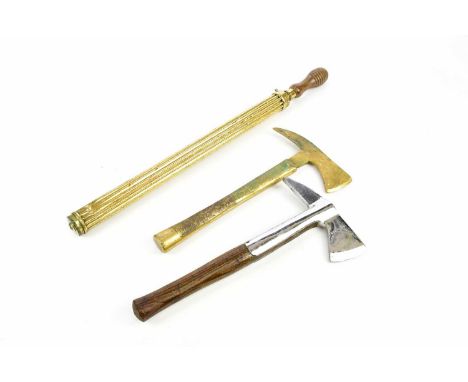 A military issue fireman's axe, with military arrow, numbered H98 and dated 1952, length 39cm, with a cast brass fireman's ax
