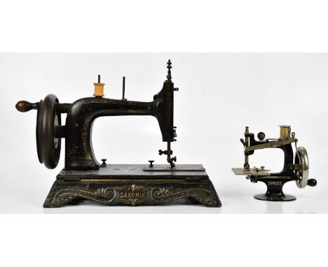 SAXONIA; a vintage manual sewing machine with mother of pearl and gilt decoration, length 35cm, and a Singer child's sewing m