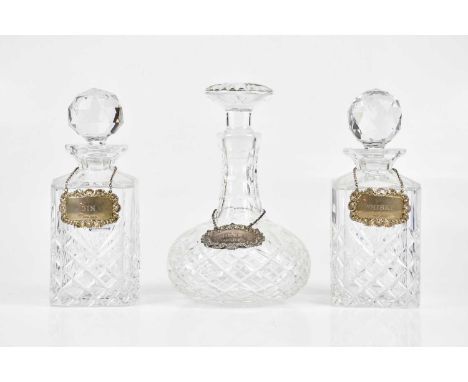 Three cut glass decanters with hallmarked silver decanter labels, 'Gin, 'Sherry' and 'Whisky' (6).