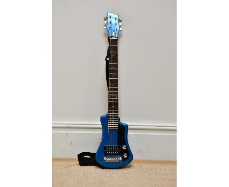 HOFNER; a six string 'Shorty' electric guitar, in blue, cased, together with a Rock Burn X-15G amplifier.