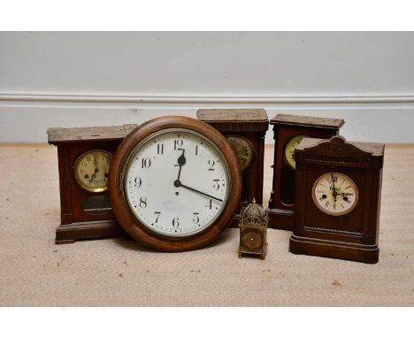 An Edwardian and later mahogany circular wall clock, with Arabic dial, diameter 39cm, with four further mantel clocks.