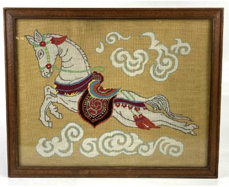 A tapestry picture of a flying horse, 38cm x 49cm, framed and glazed. 
