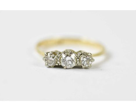 An 18ct yellow gold and graduated three stone diamond ring, the largest stone weighing approx. 0.15cts, size K, approx. 2.2g.