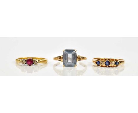 An 18ct yellow gold diamond and sapphire three stone dress ring, size K, a yellow metal diamond and sapphire five stone dress