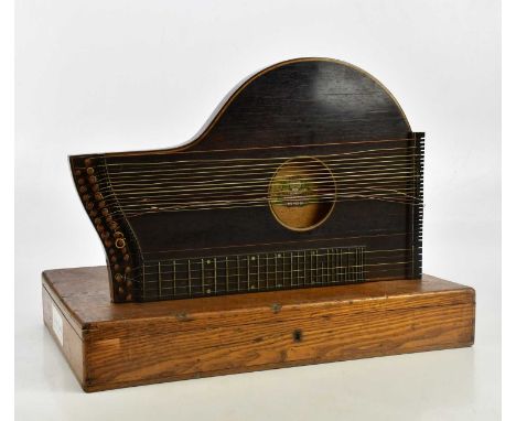 J HASLWANTER; a German rosewood zither in oak case.