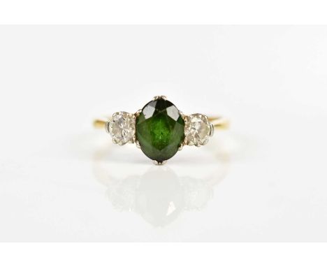 An 18ct gold and platinum diamond and tourmaline three stone ring, size K, approx 2.7g.Condition Report: Hallmark is rubbed, 
